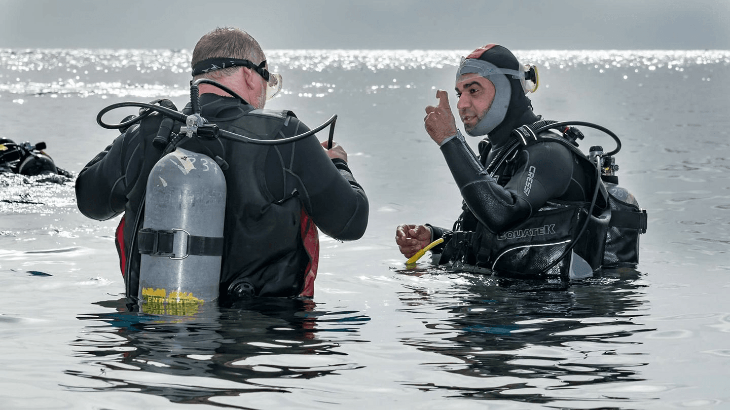 Osama teaching a diving student in the crystal clear waters of Dahab, Egypt - PADI Master Scuba Diver Trainer
